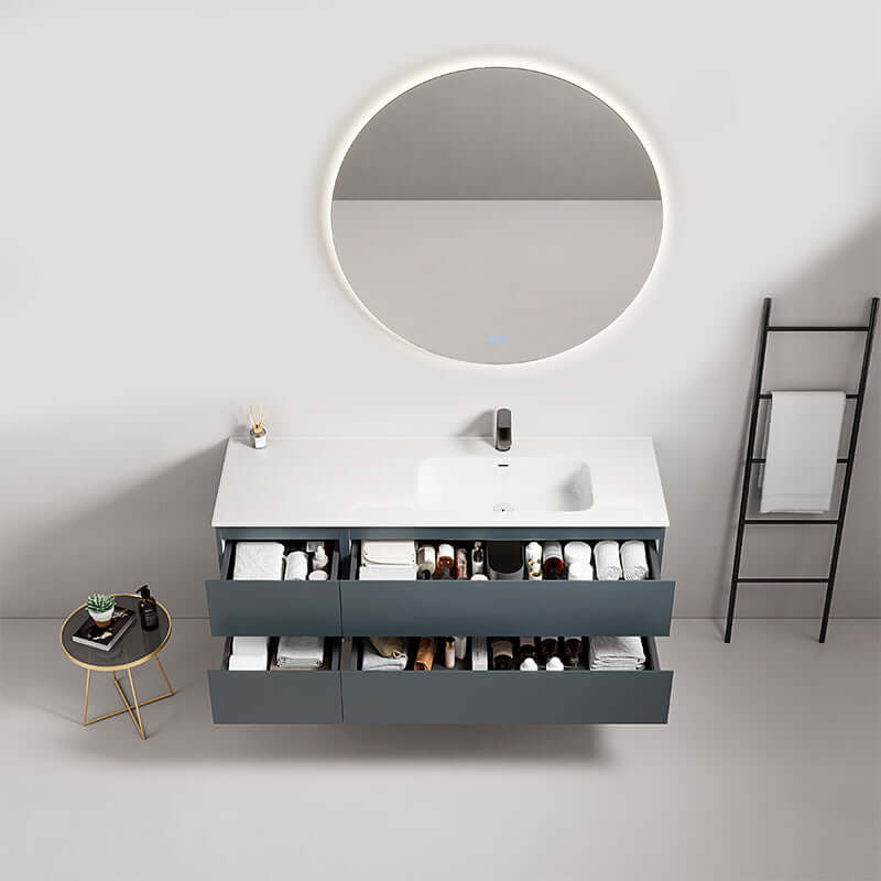 Mobile bagno sospeso 140 cm blu mare con lavabo a destra e specchio tondo retroilluminato, design moderno e funzionale.