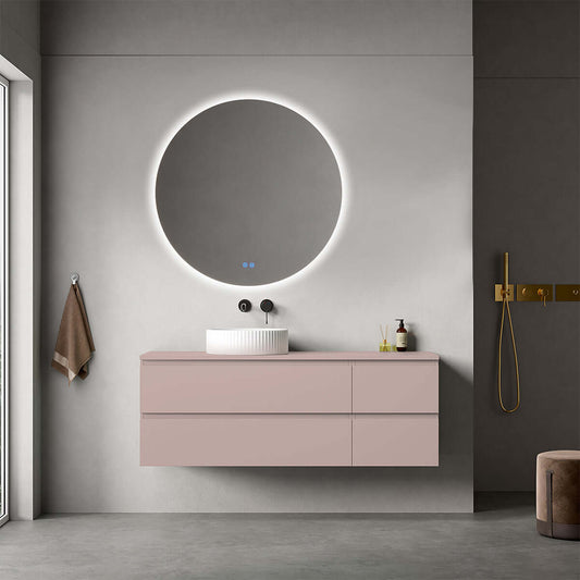 Mobile bagno sospeso rosa retrò con lavabo d'appoggio e specchio tondo retroilluminato, design moderno.