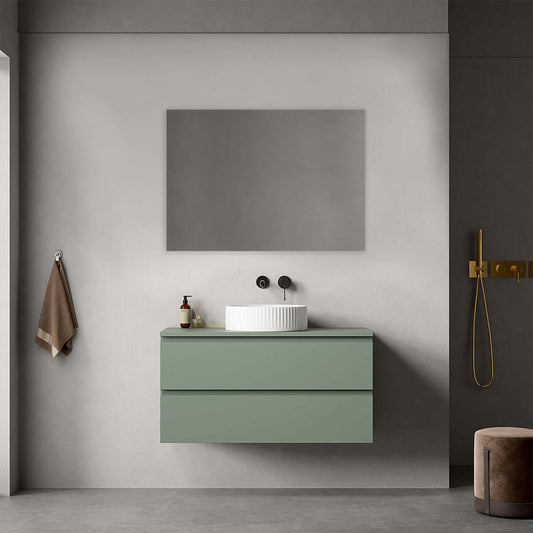 Mobile bagno sospeso verde salvia con lavabo d'appoggio e specchio quadrato, design moderno per bagno contemporaneo.