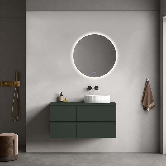 Mobile bagno sospeso verde comodoro con lavabo d'appoggio e specchio tondo retroilluminato in un design moderno.
