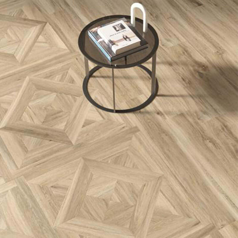 Interior view featuring Gres Porcellanato Effetto Legno 90x90 flooring with a black side table and magazines.