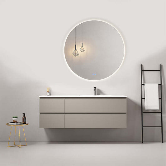 Mobile bagno sospeso grigio cenere con lavabo, specchio tondo retroilluminato e decorazioni moderne.