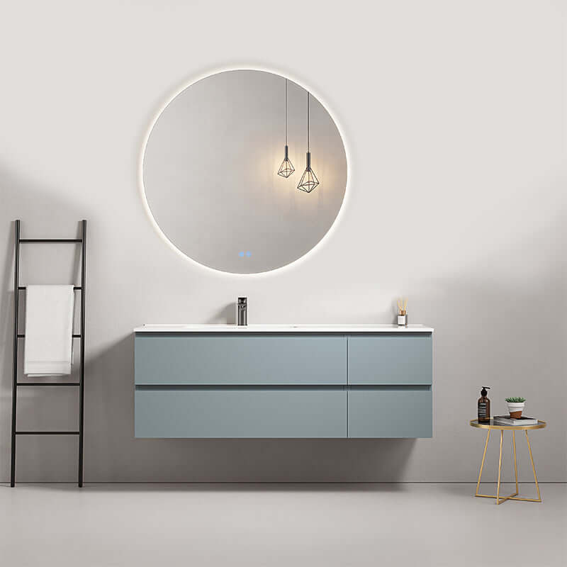 Mobile bagno sospeso 140 cm Blu Avio con lavabo a sinistra e specchio tondo retroilluminato.