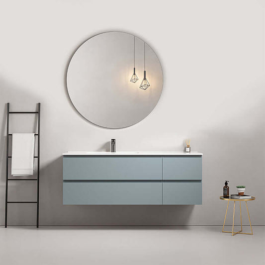 Mobile bagno sospeso 140 cm Blu Avio con lavabo a sinistra e specchio tondo nel design contemporaneo.