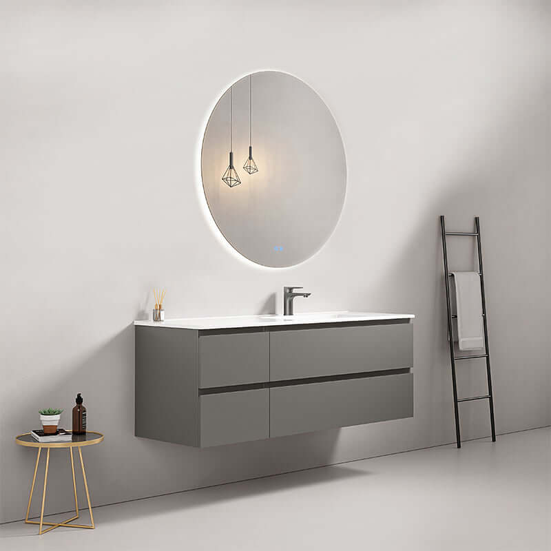 Mobile bagno sospeso grigio Londra con lavabo a destra e specchio tondo retroilluminato in design moderno.