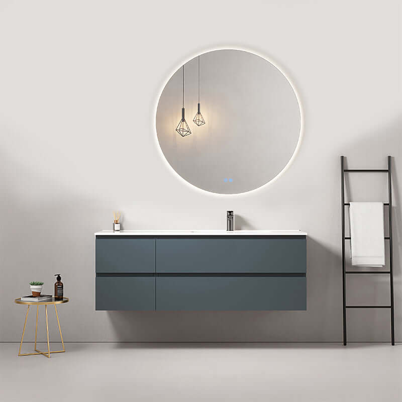 Mobile bagno sospeso 140 cm Blu Mare con lavabo a destra e specchio tonde retroilluminato.