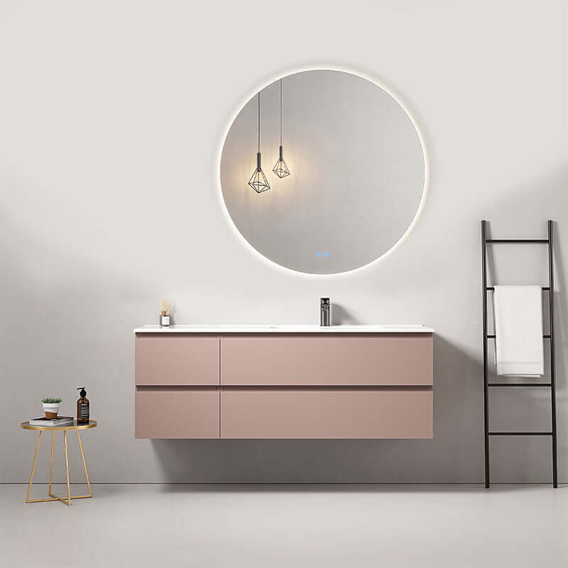 Mobile bagno sospeso rosa retro con lavabo a destra e specchio tondo retroilluminato, design moderno.