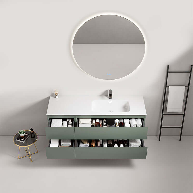 Mobile bagno sospeso verde salvia da 140 cm con lavabo, specchio tondo retroilluminato e scaffale.