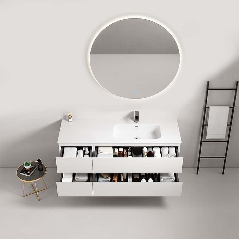 Mobile bagno sospeso Fiji 140 cm con lavabo a destra e specchio tondo retroilluminato.