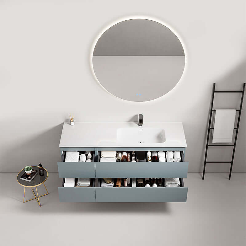 Mobile bagno sospeso Fiji 140 cm con lavabo a destra e specchio tondo retroilluminato, design moderno e funzionale.