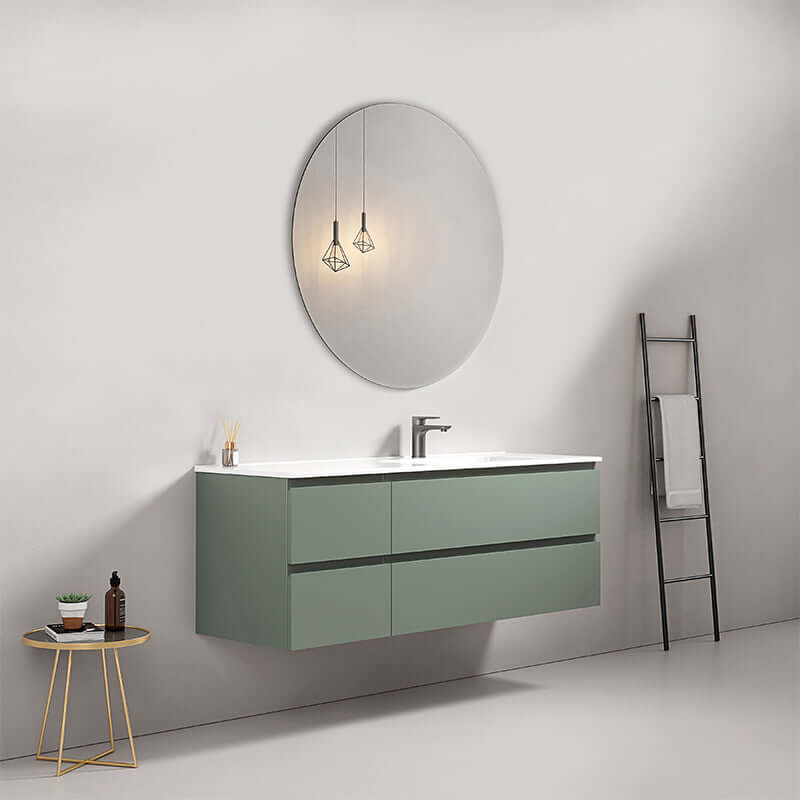 Mobile bagno sospeso verde salvia con lavabo a destra e specchio tondo su parete moderna. (25686994)