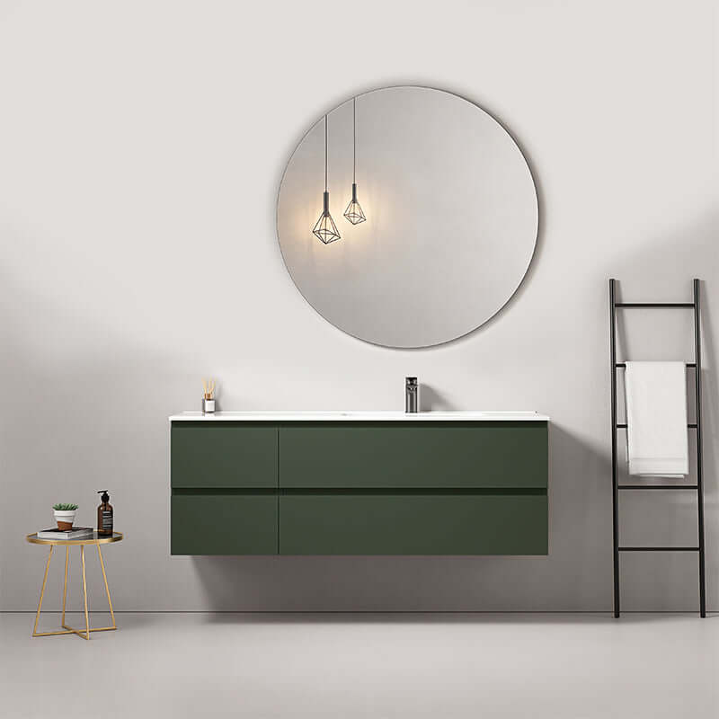 Mobile bagno sospeso verde comodoro da 140 cm con lavabo a destra e specchio tondo in ambiente moderno. (25686889)