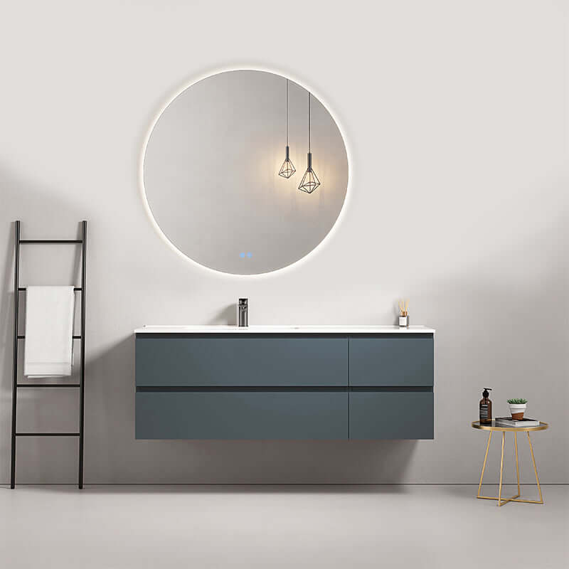 Mobile bagno sospeso 140 cm Blu Mare con lavabo a sinistra e specchio tondo retroilluminato.