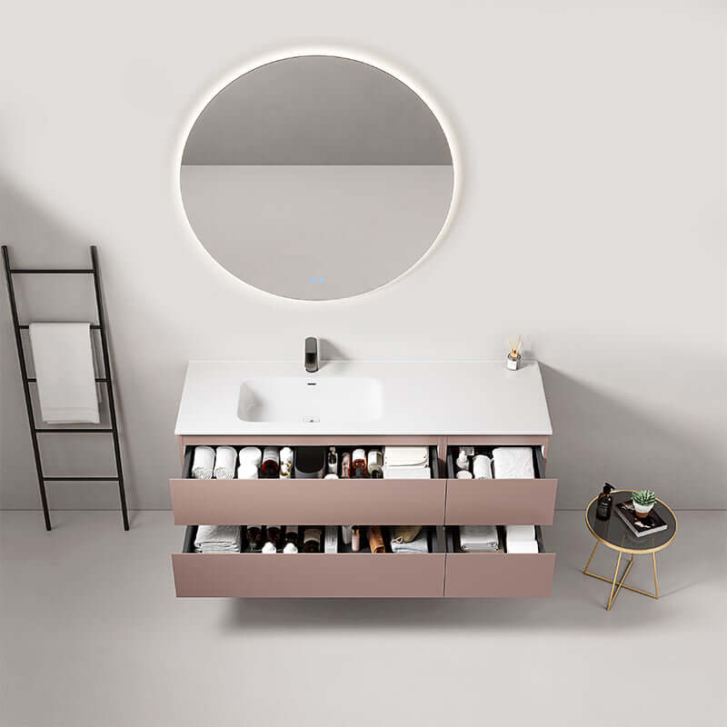 Mobile bagno sospeso Fiji 140 cm in rosa retro con lavabo, specchio tondo retroilluminato e cassetti funzionali.