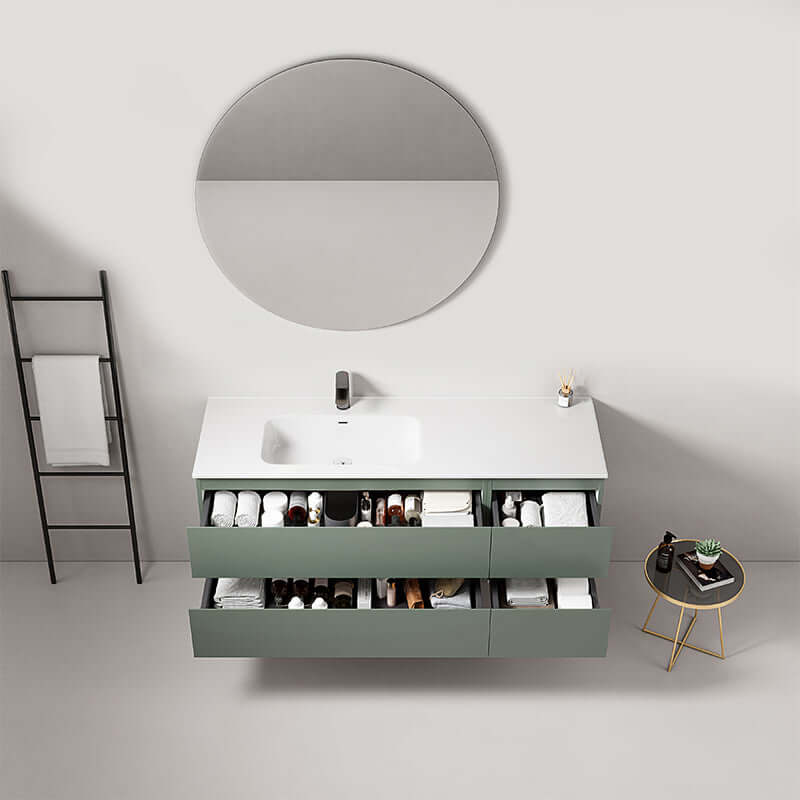 Mobile bagno sospeso Verde Salvia con lavabo a sinistra, specchio tondo e cassetti aperti per spazio di archiviazione. (25687045)