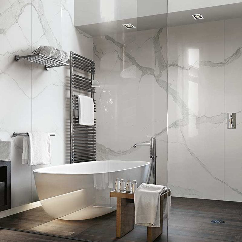 Modern bathroom featuring Gres Porcellanato Effetto Marmo Statuario tiles, elegant design with a freestanding tub and sleek finishes.