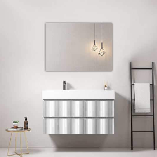Mobile bagno sospeso cannettato 100 cm Bianco Lavabo a Sinistra in Resina Specchio Quadro - Fiji Paint in ambientazione moderna.