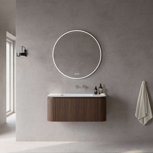 Stylish suspended bathroom cabinet in medium oak with illuminated round mirror, modern design for contemporary interiors.