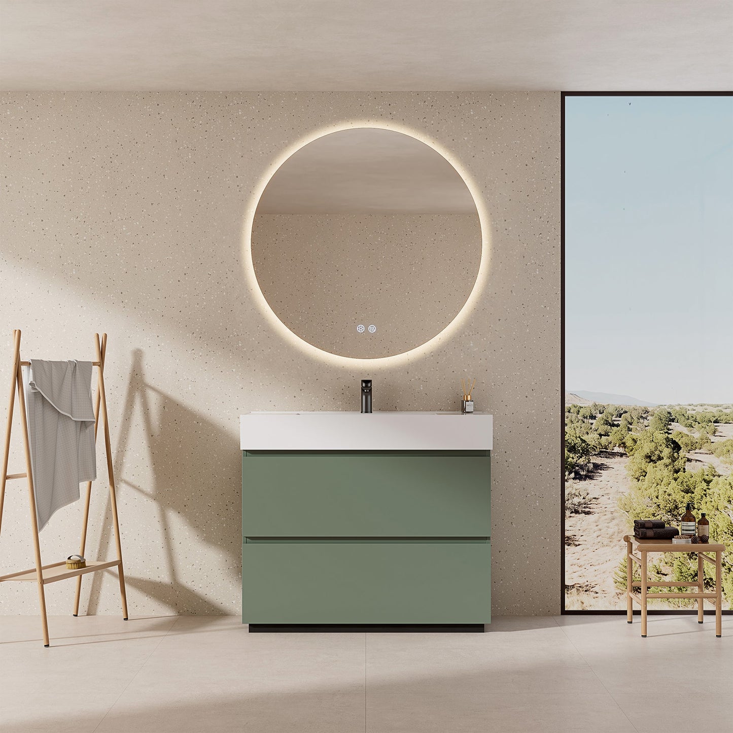 Mobile bagno a terra verde salvia con lavabo in resina e specchio rotondo luminoso.