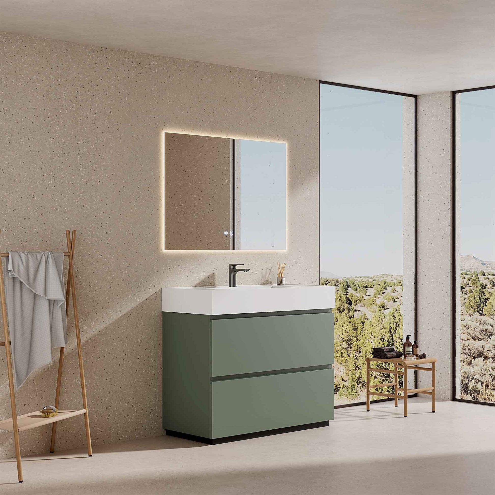 Mobile bagno a terra verde salvia 100 cm con lavabo in resina e specchio retroilluminato.